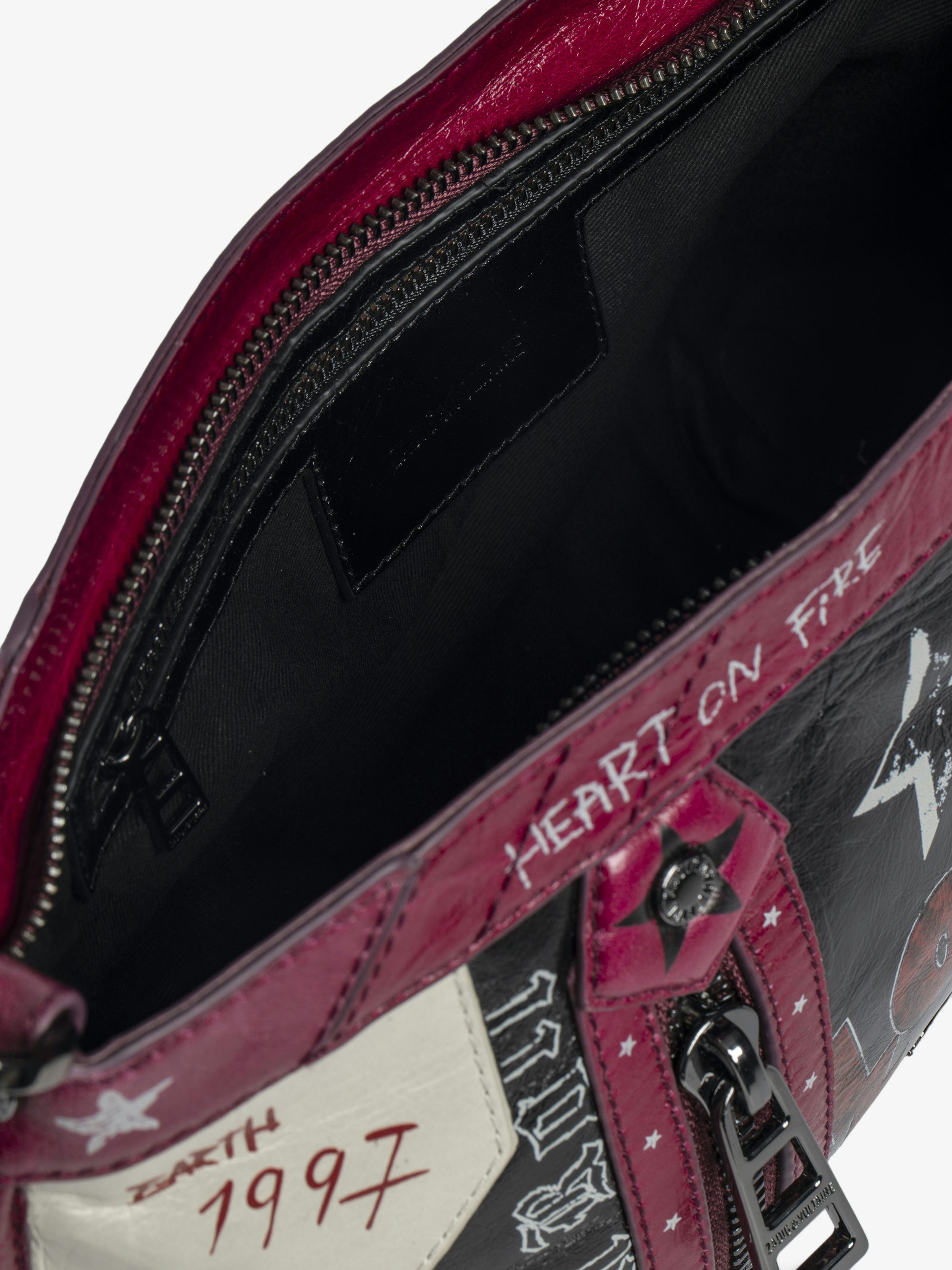 Sunny Moody Punk Bag - Vintage-inspired patent leather bag with adjustable shoulder strap and wing signature.